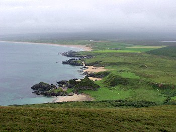 The view from Cnoc Mór Ghrasdail, Port Alsaig in the foreground, the Machrie Hotel in the background Picture of the view towards Kintra with the Machrie Hotel in the background