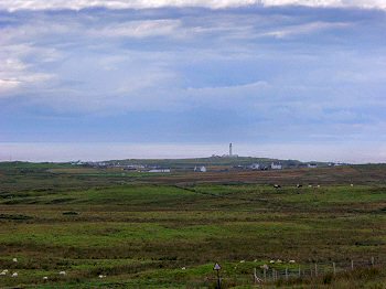 View from the Rhinns to Portnahaven and Port Wemyss with the lighthouse on Orsay Picture of the view southwest from the Rhinns