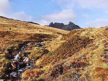 Picture of a burn with mountains in the background