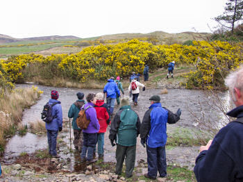 Picture of people about to cross a burn