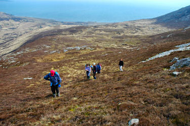 Picture of walkers climbing up Beinn Bheigier