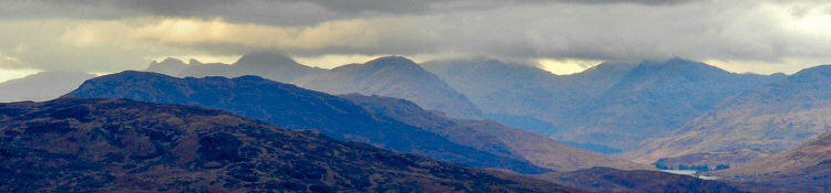 Picture of cloud covered mountains in the distance