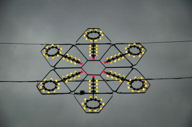 Picture of Christmas lights hanging over a street