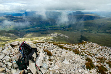 Picture of a view over a cairn down into a glen
