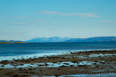 Picture of a view down a loch with an island in the distance