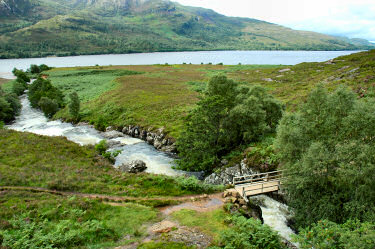 Picture of a bridge over a burn at full flow