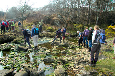 Picture of walkers crossing a burn