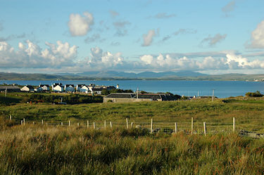 Picture of a coastal village with distillery warehouses