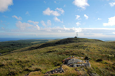 Picture of the top of a hill with some telecommunication masts